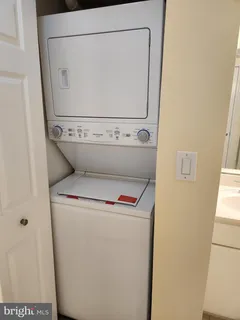 a bathroom with a sink and stainless steel appliances