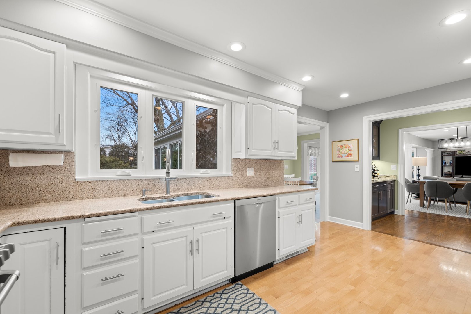 2441 Pick Drive Glenview, IL 60025 - Photo 14 of 43 a kitchen with a sink stove and cabinets