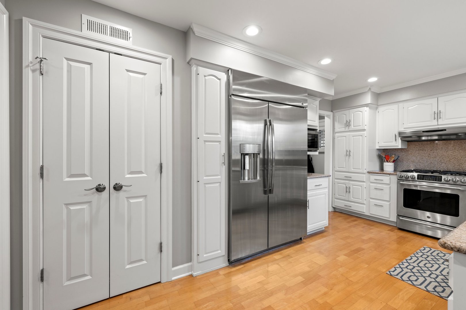 2441 Pick Drive Glenview, IL 60025 - Photo 15 of 43 a kitchen with stainless steel appliances a refrigerator and a stove top oven