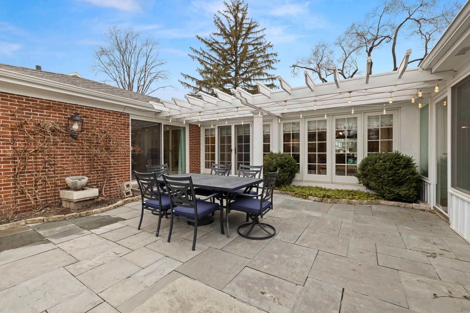 2441 Pick Drive Glenview, IL 60025 - Photo 21 of 43 a view of a house with backyard sitting area and porch