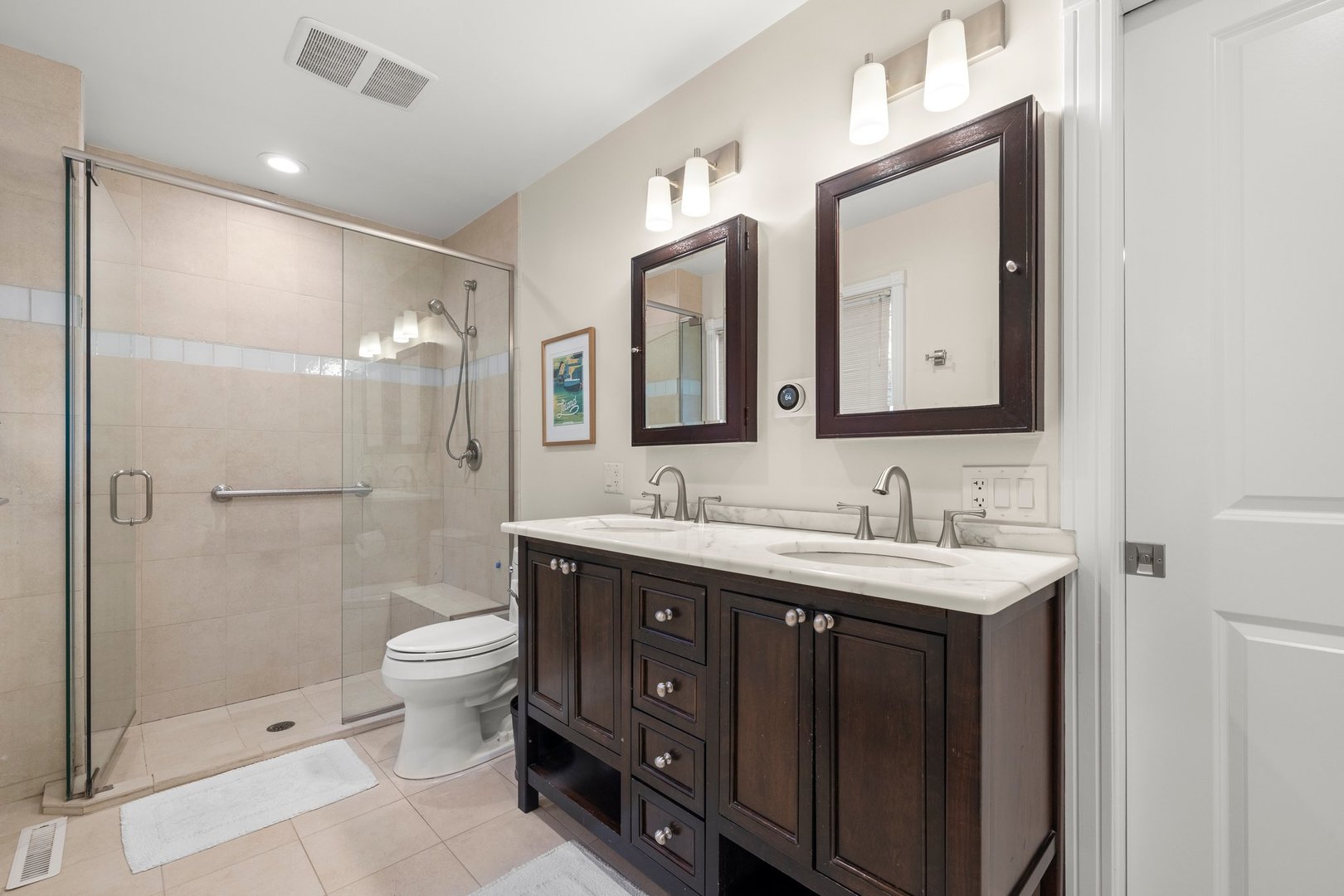 2441 Pick Drive Glenview, IL 60025 - Photo 26 of 43 a bathroom with a double vanity sink mirror double shower and a toilet