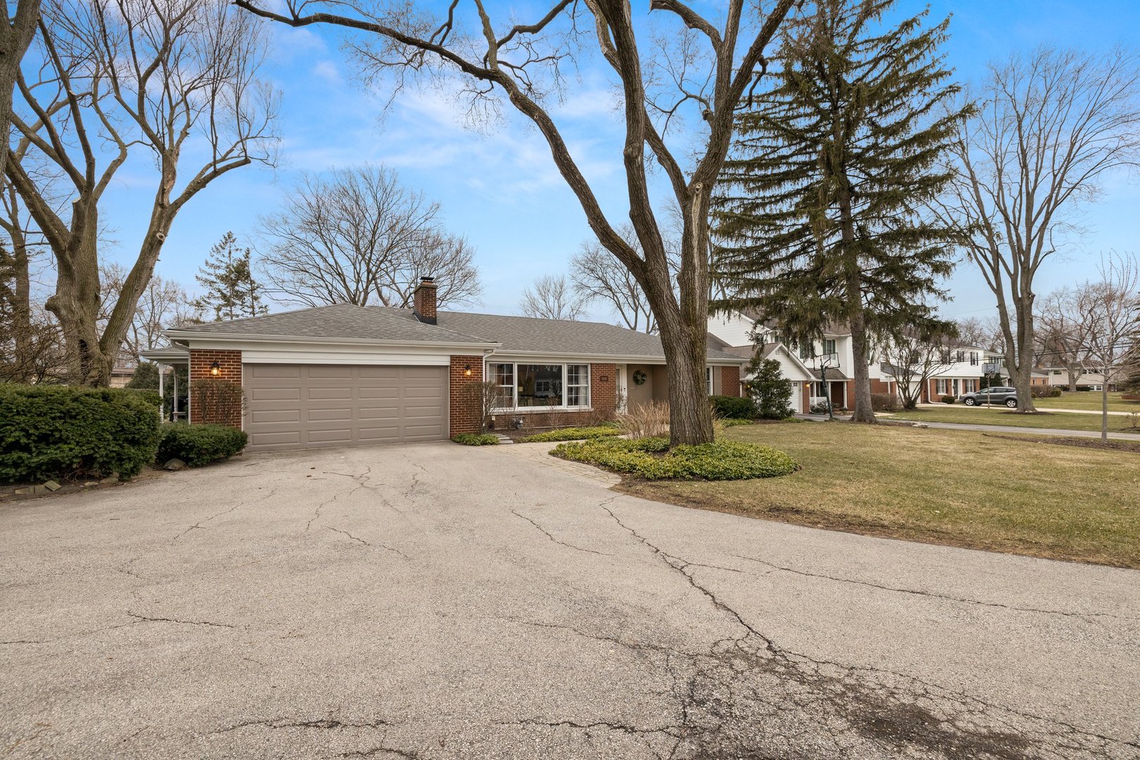 2441 Pick Drive Glenview, IL 60025 - Photo 43 of 43 a front view of a house with a yard and garage