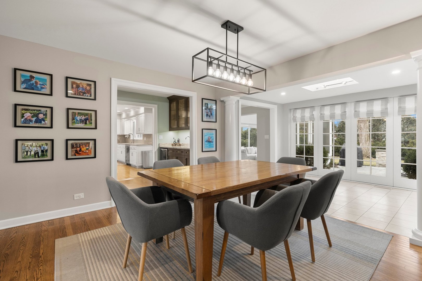 2441 Pick Drive Glenview, IL 60025 - Photo 7 of 43 a view of a dining room with furniture a chandelier and wooden floor