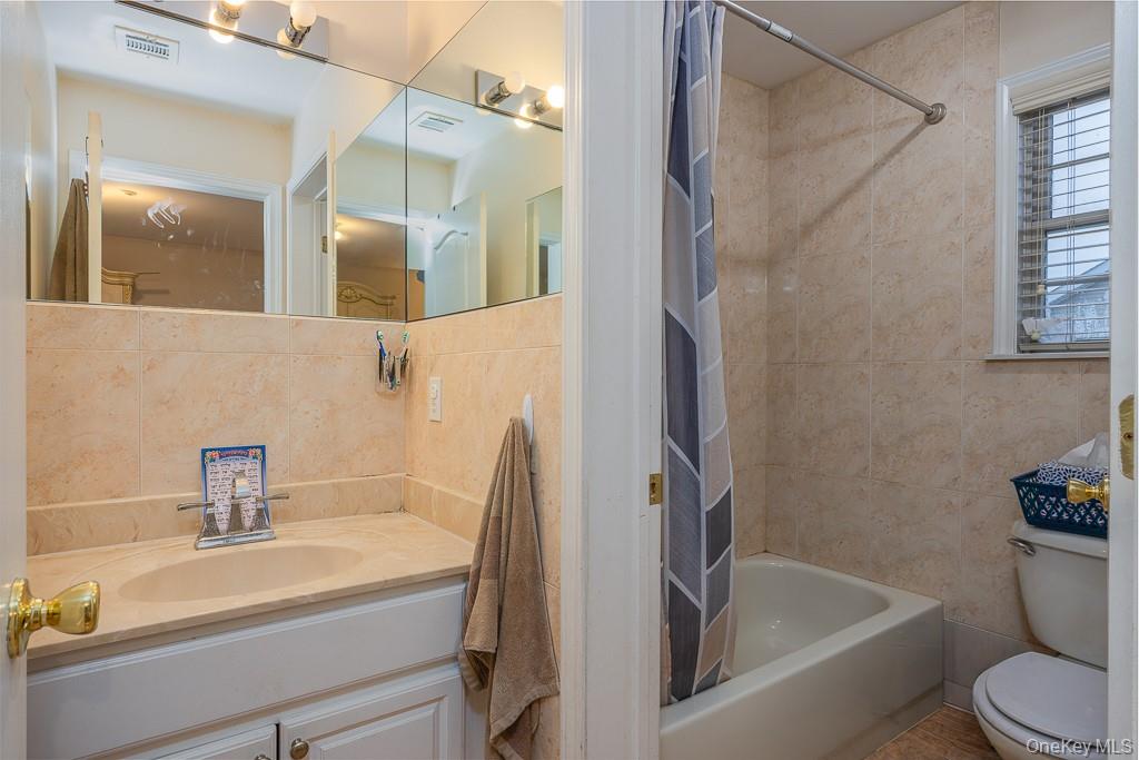 3 Horizon Court, Unit 304 Monsey, NY 10952 - Photo 25 of 36 a bathroom with a sink a toilet and shower