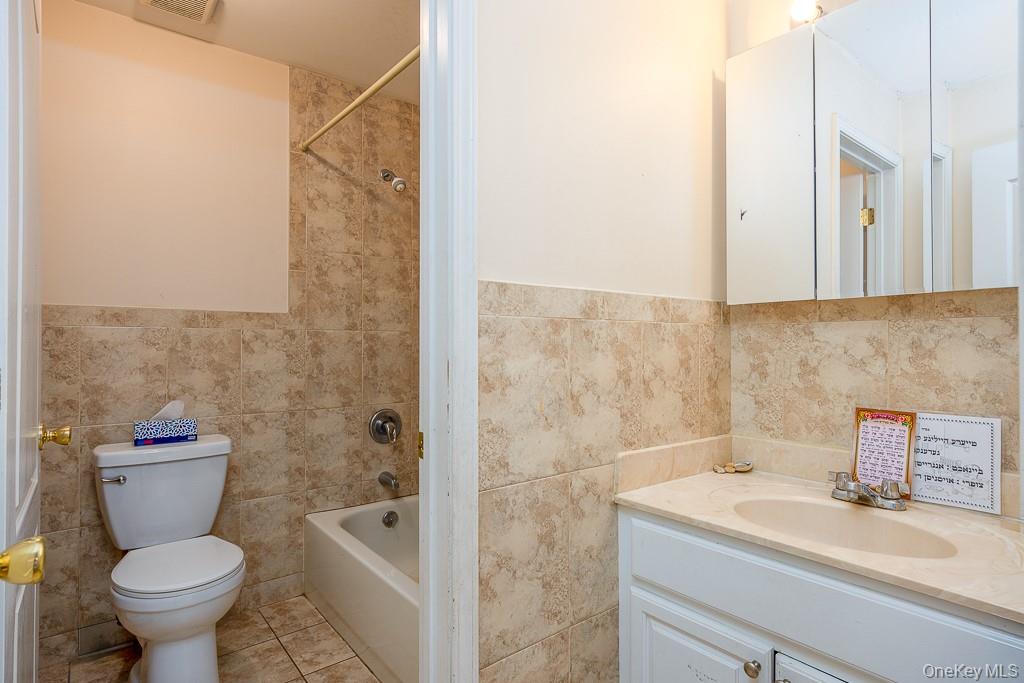 3 Horizon Court, Unit 304 Monsey, NY 10952 - Photo 27 of 36 a bathroom with a sink toilet and shower