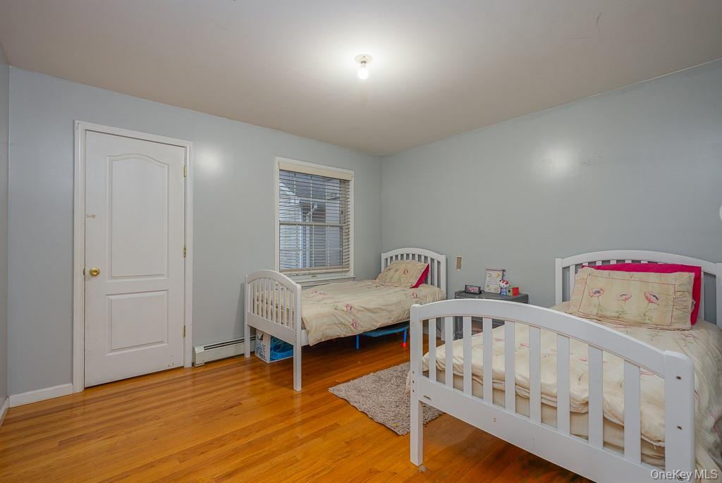 3 Horizon Court, Unit 304 Monsey, NY 10952 - Photo 28 of 36 a bedroom with furniture and wooden floor