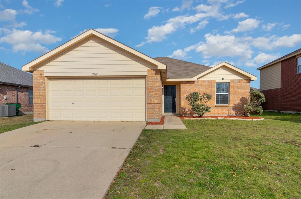 12618 Carpenter Lane Rhome, TX 76078 - Photo 1 of 1 a front view of a house with a yard and garage