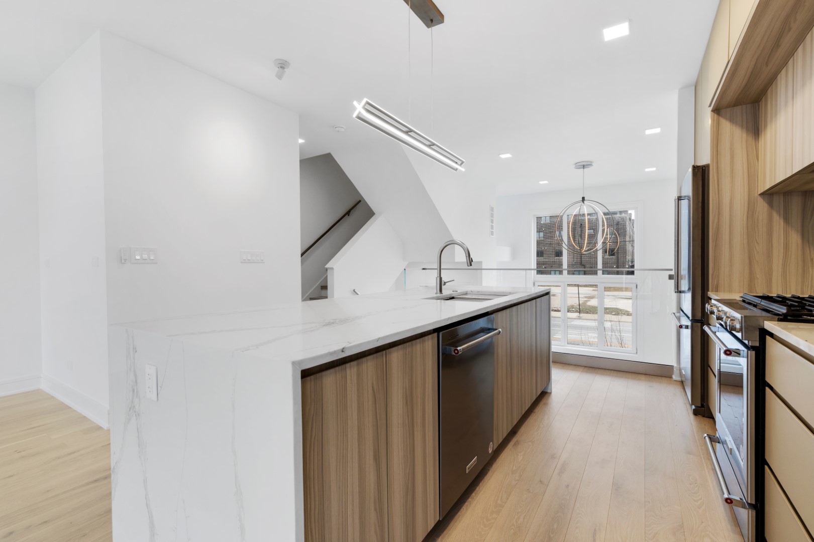 336 East Pershing Road Chicago, IL 60653 - Photo 12 of 86 a kitchen with stainless steel appliances a sink a stove top oven a counter space and cabinets