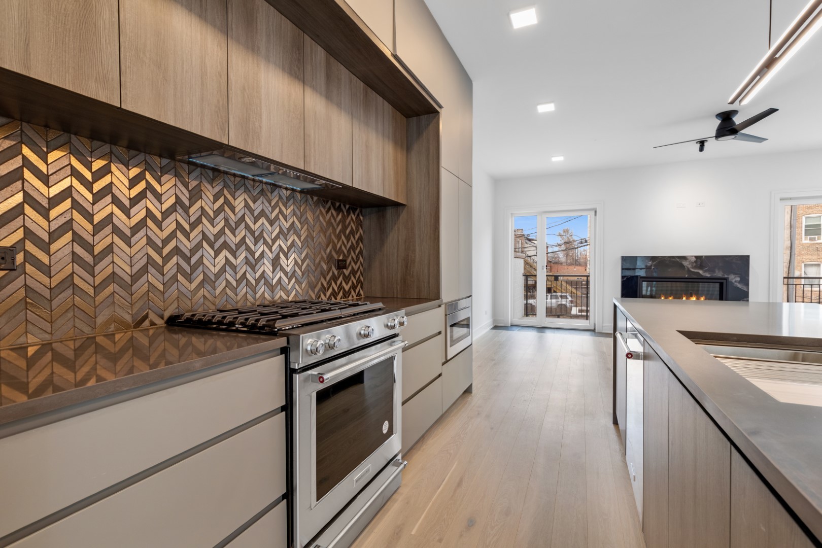 336 East Pershing Road Chicago, IL 60653 - Photo 16 of 86 a kitchen with stainless steel appliances granite countertop a stove and a sink