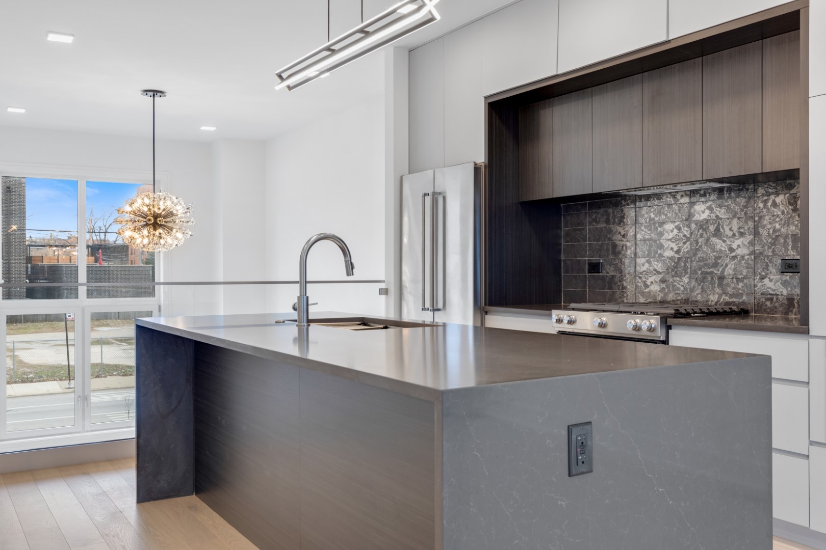 336 East Pershing Road Chicago, IL 60653 - Photo 24 of 86 a kitchen with kitchen island a sink appliances and cabinets