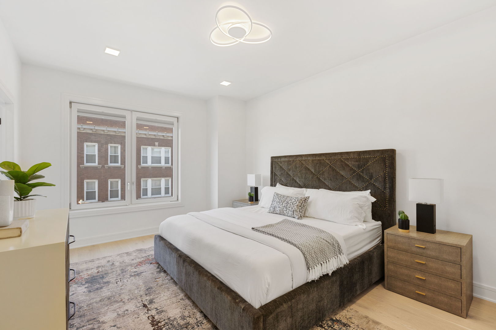 336 East Pershing Road Chicago, IL 60653 - Photo 39 of 86 a bedroom with a large bed and a window