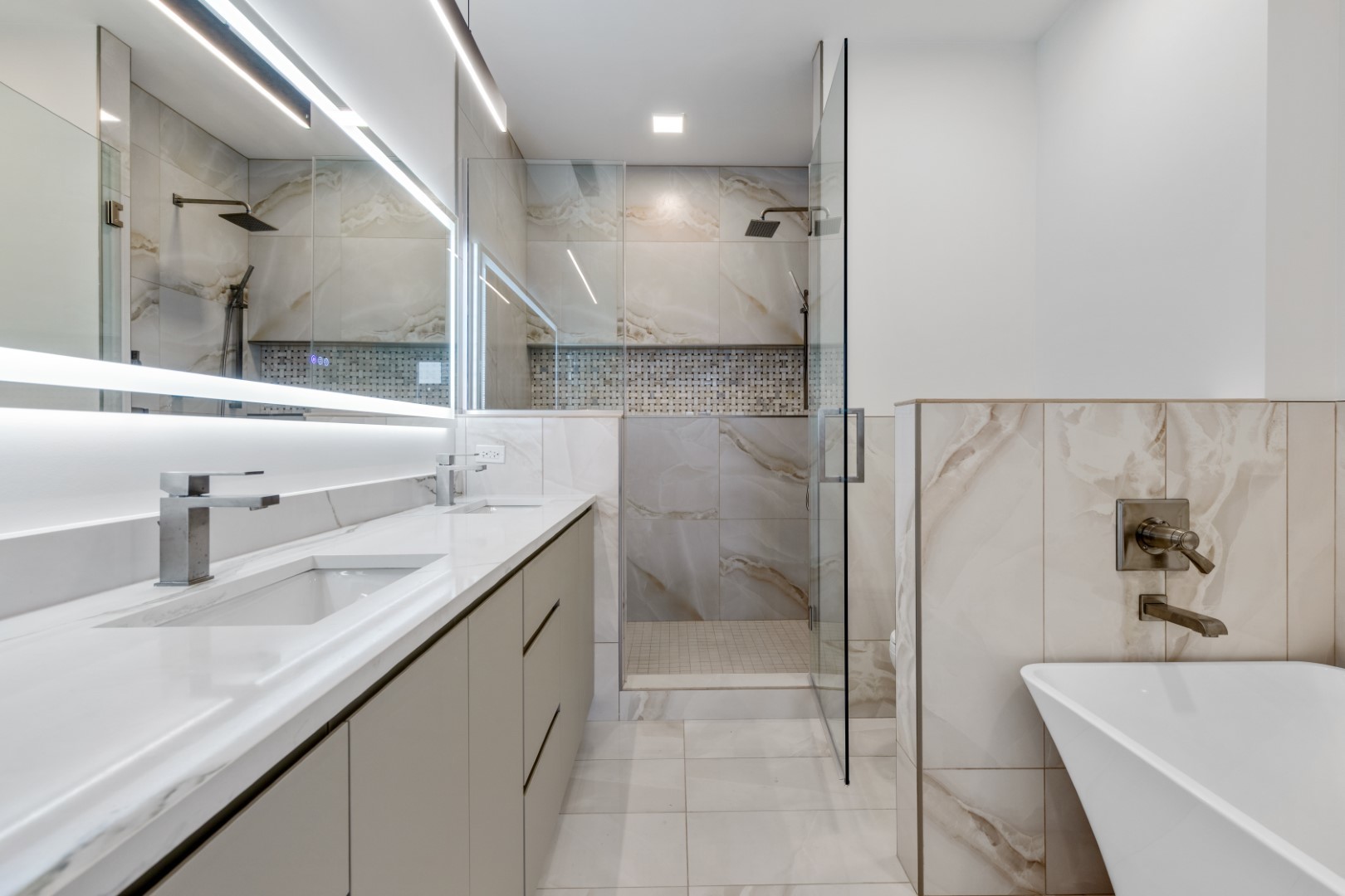 336 East Pershing Road Chicago, IL 60653 - Photo 45 of 86 a bathroom with a granite countertop sink a toilet a mirror and bathtub