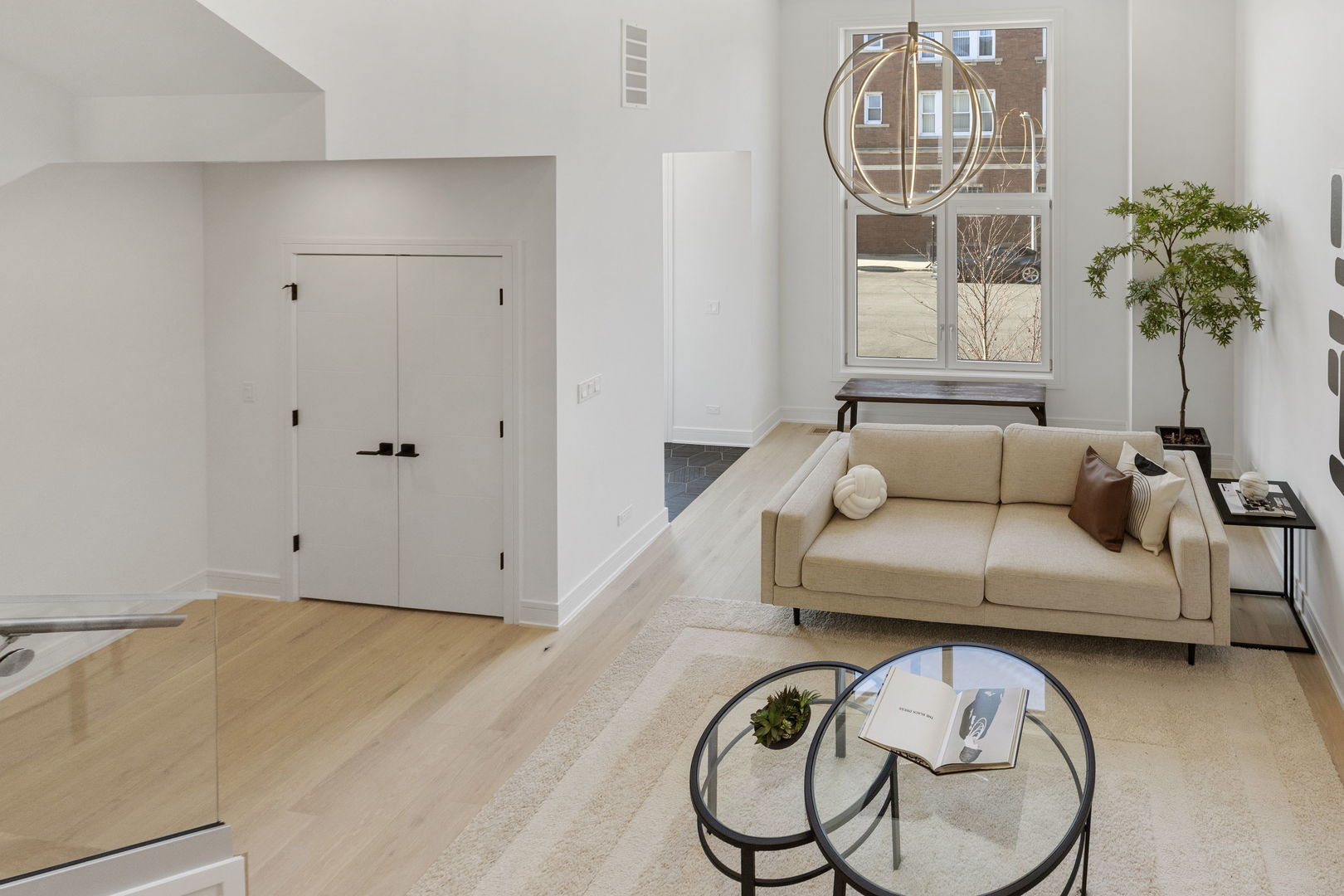 336 East Pershing Road Chicago, IL 60653 - Photo 5 of 86 a living room with furniture a chandelier and a window