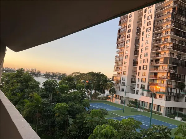 a view of a building with a yard