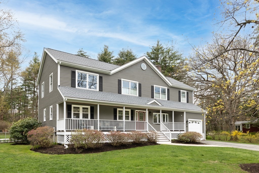 55 Hickory Road Sudbury, MA 01776 - Photo 1 of 42 a front view of a house with a yard