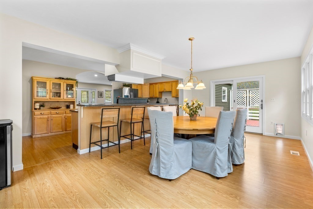 55 Hickory Road Sudbury, MA 01776 - Photo 12 of 42 a dining room filled with furniture and wooden floor