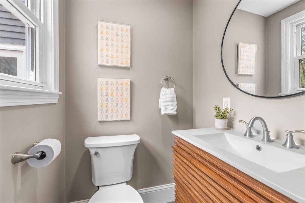 55 Hickory Road Sudbury, MA 01776 - Photo 18 of 42 a bathroom with a sink a toilet and a mirror