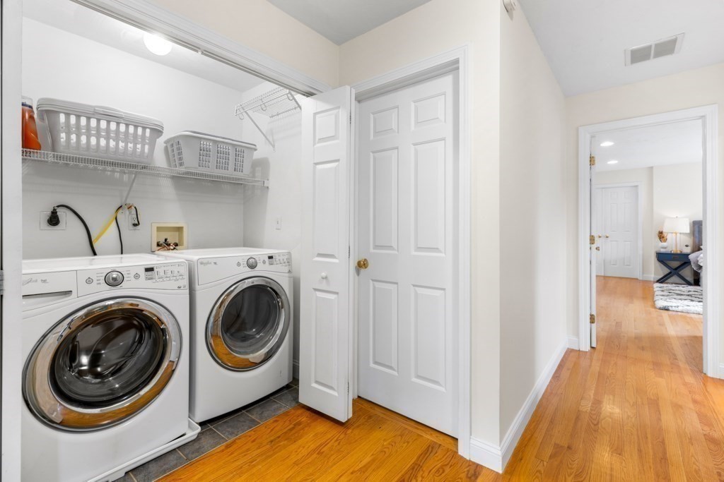 55 Hickory Road Sudbury, MA 01776 - Photo 30 of 42 a view of a hallway with washer and dryer