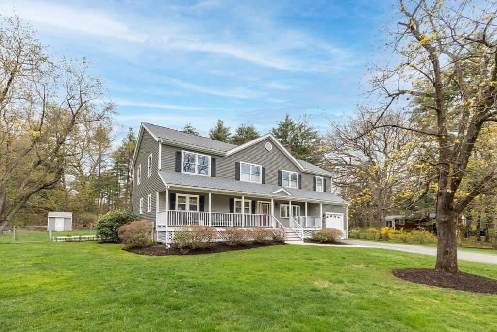 55 Hickory Road Sudbury, MA 01776 - Photo 38 of 42 a front view of a house with a garden