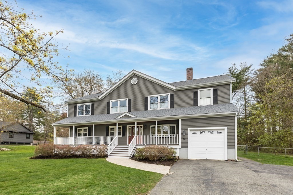 55 Hickory Road Sudbury, MA 01776 - Photo 41 of 42 front view of a house with a yard