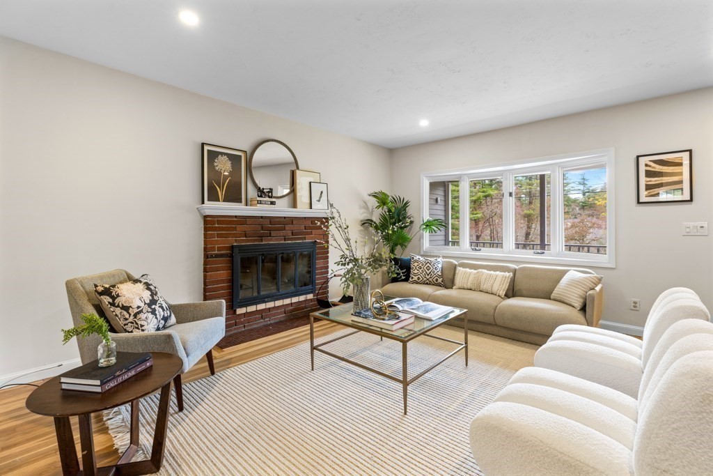 55 Hickory Road Sudbury, MA 01776 - Photo 5 of 42 a living room with furniture a window and a fireplace