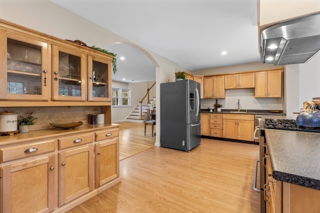 55 Hickory Road Sudbury, MA 01776 - Photo 9 of 42 a kitchen with cabinets and a refrigerator