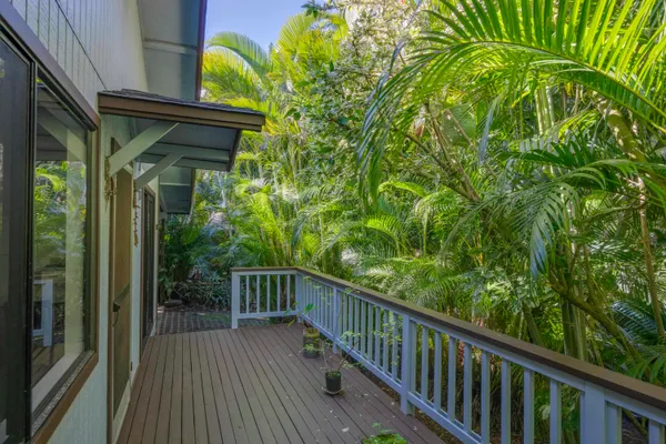 a view of balcony with wooden floor