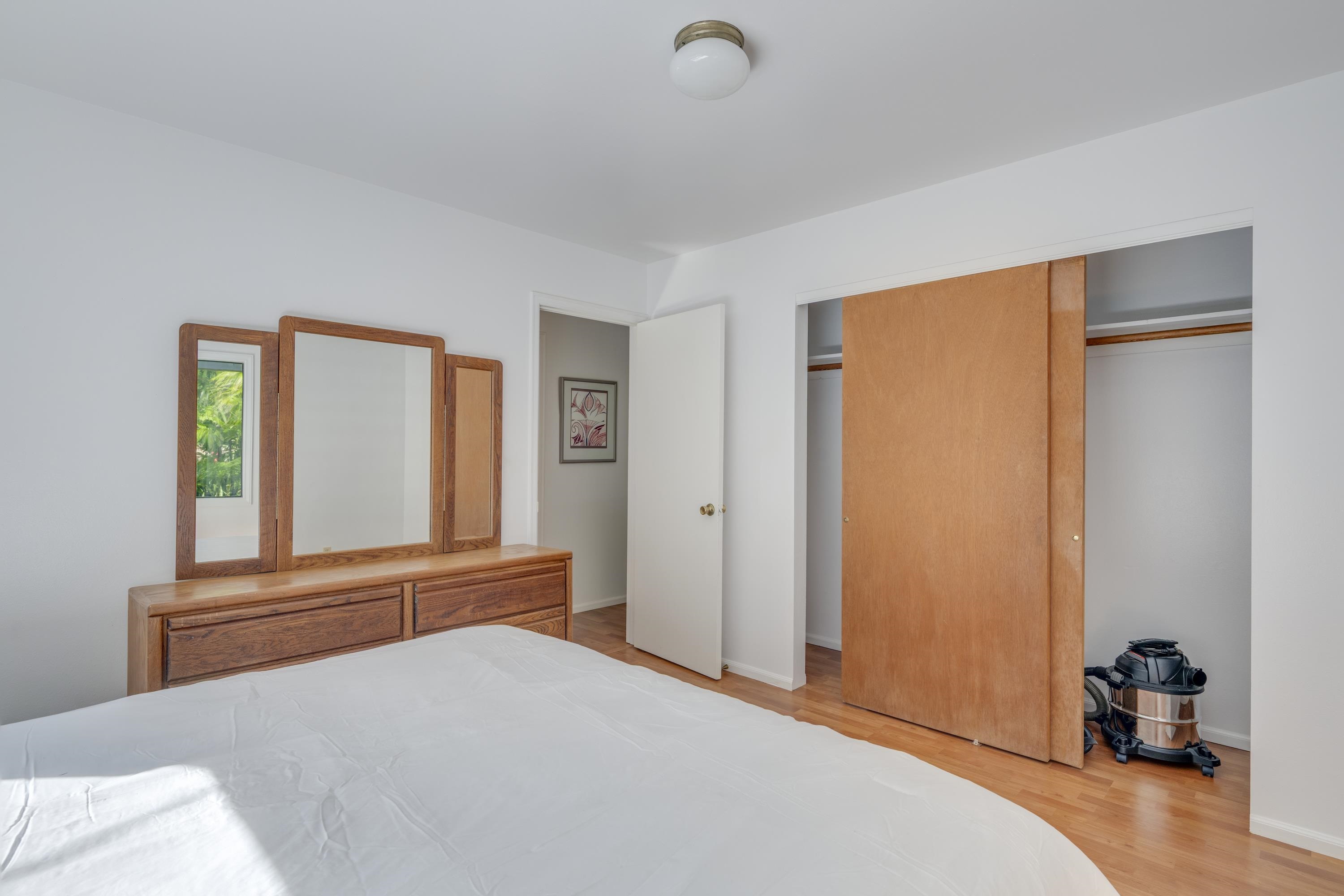 1002 Kauhikoa Road, Unit 2 Haiku, HI 96708 - Photo 20 of 24 a bedroom with a bed and a window