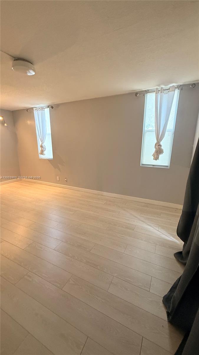 821 Lyons Road, Unit 21102 Coconut Creek, FL 33063 - Photo 16 of 17 a view of an empty room