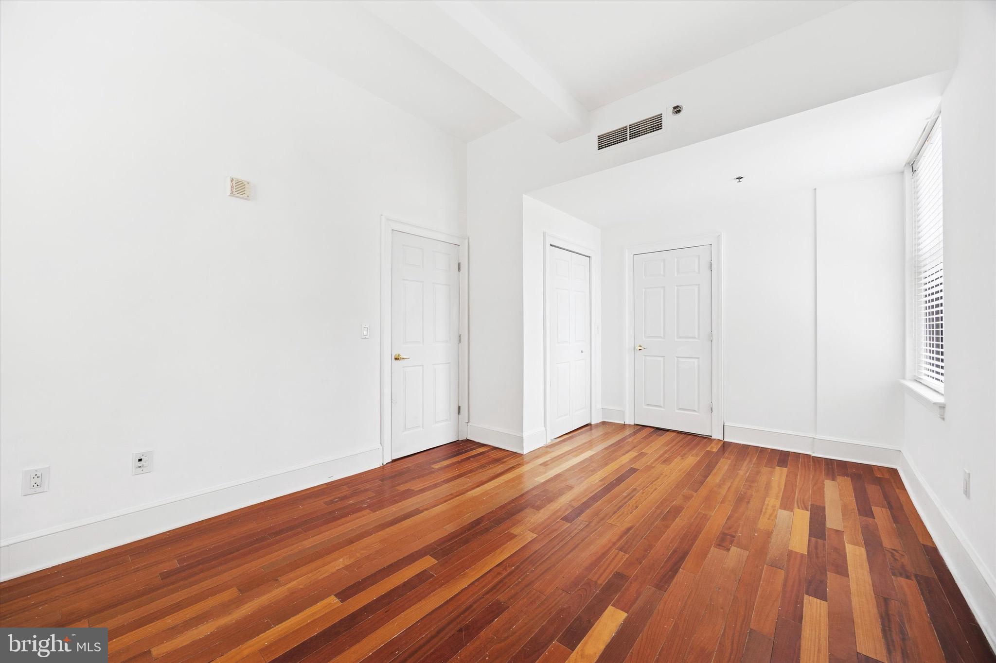 1500 Chestnut Street, Unit 15H Philadelphia, PA 19102 - Photo 14 of 25 a view of a room with wooden floor