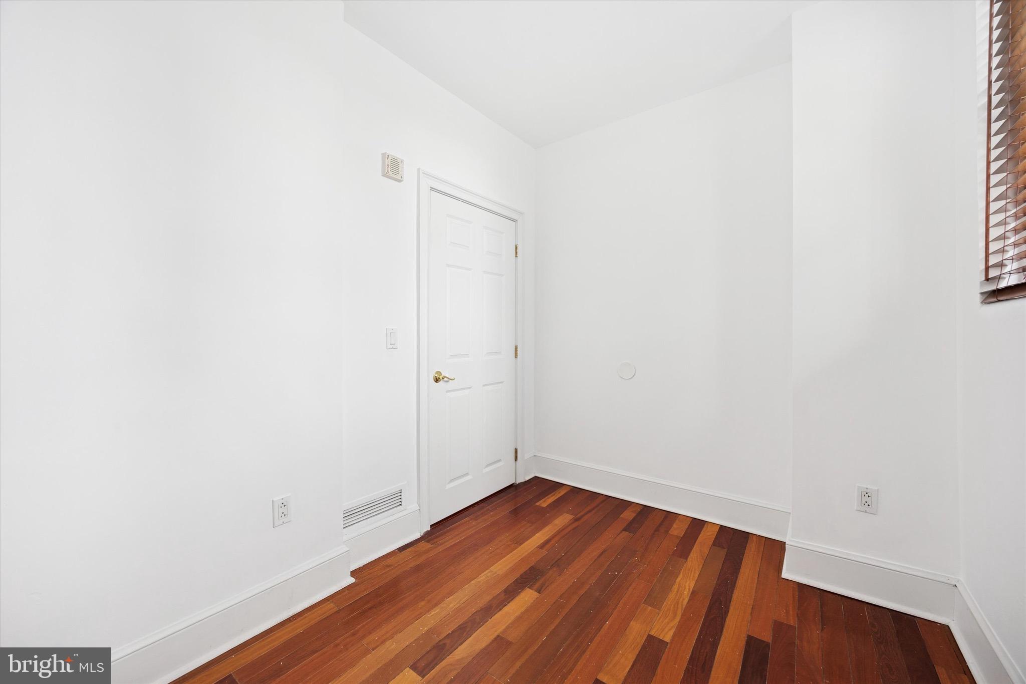1500 Chestnut Street, Unit 15H Philadelphia, PA 19102 - Photo 21 of 25 a view of a room with wooden floor