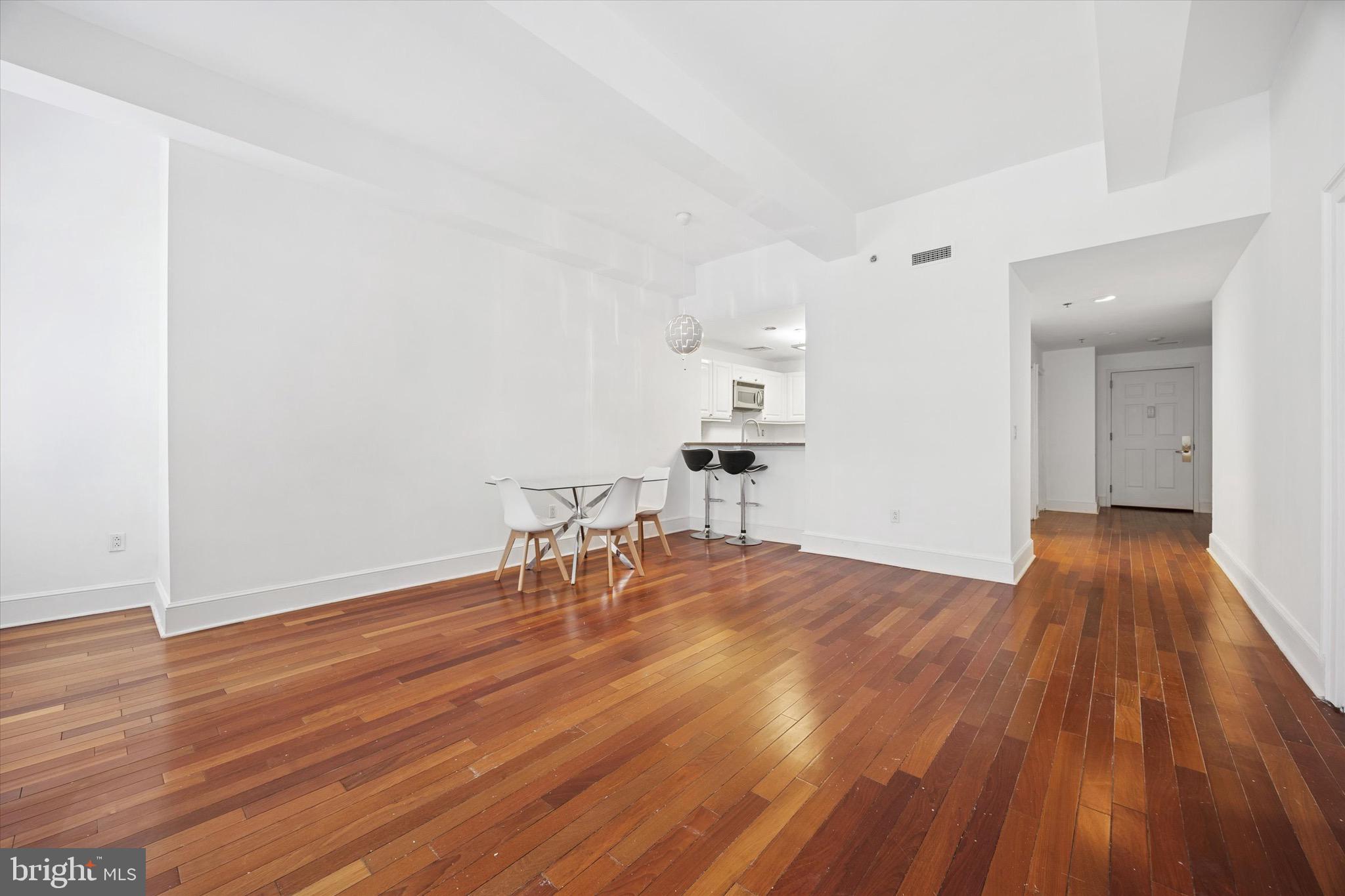 1500 Chestnut Street, Unit 15H Philadelphia, PA 19102 - Photo 5 of 25 a view of empty room with wooden floor