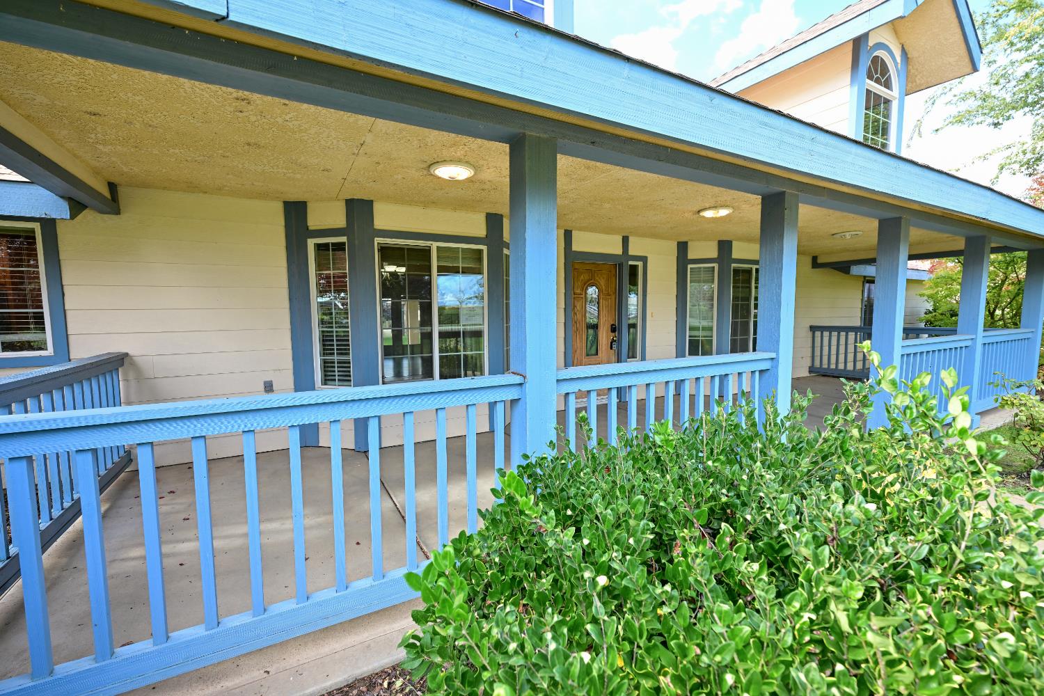 21088 Forest Glen Road Madera, CA 93638 - Photo 3 of 31 a view of a brick house with large windows