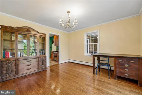 a living room with furniture and large windows
