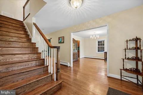 a kitchen with stainless steel appliances granite countertop a refrigerator a stove and a sink