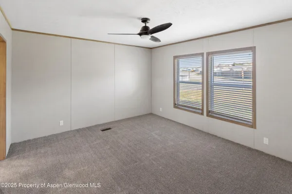 a view of an empty room with a window