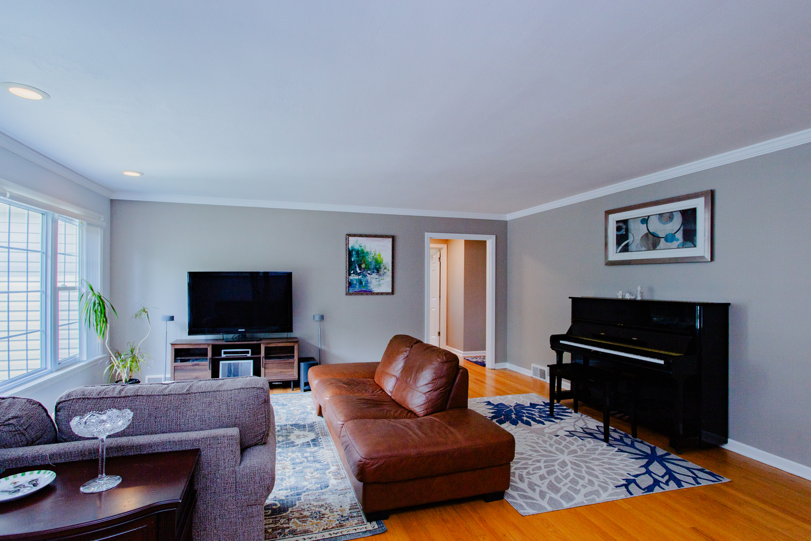 1749 North Happ Road Northbrook, IL 60062 - Photo 3 of 27 a living room with furniture and a flat screen tv