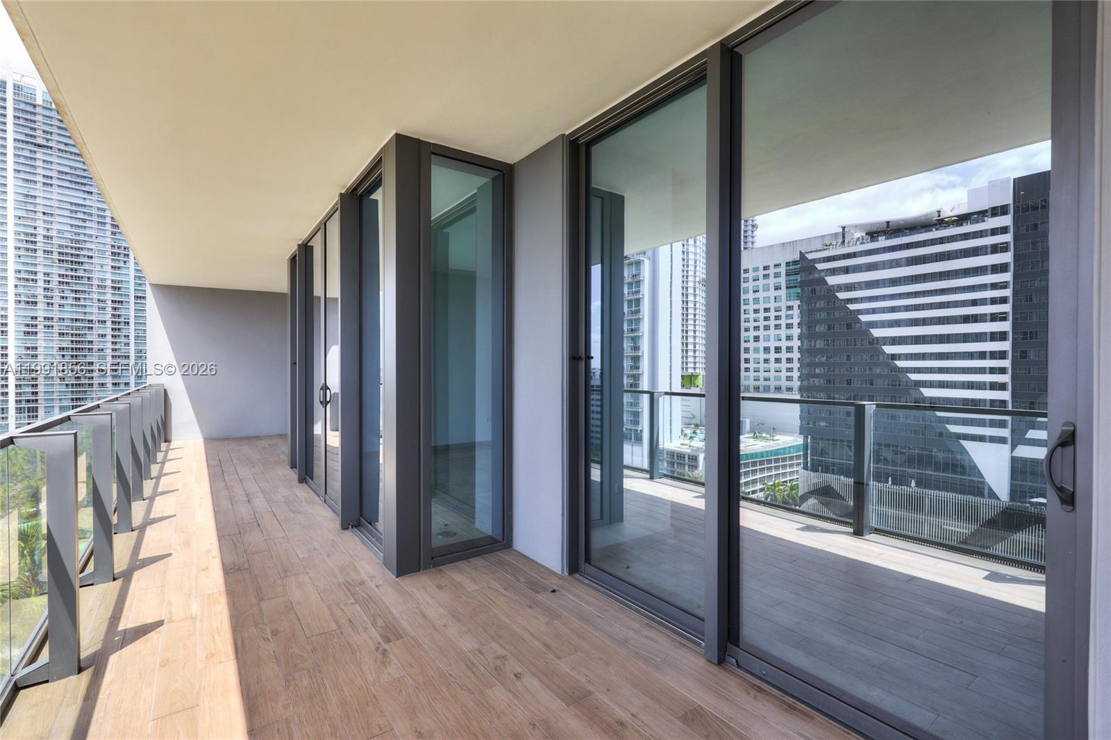 88 Southwest 7th Street, Unit 904 Miami, FL 33130 - Photo 29 of 34 a view of entryway and hall with wooden floor