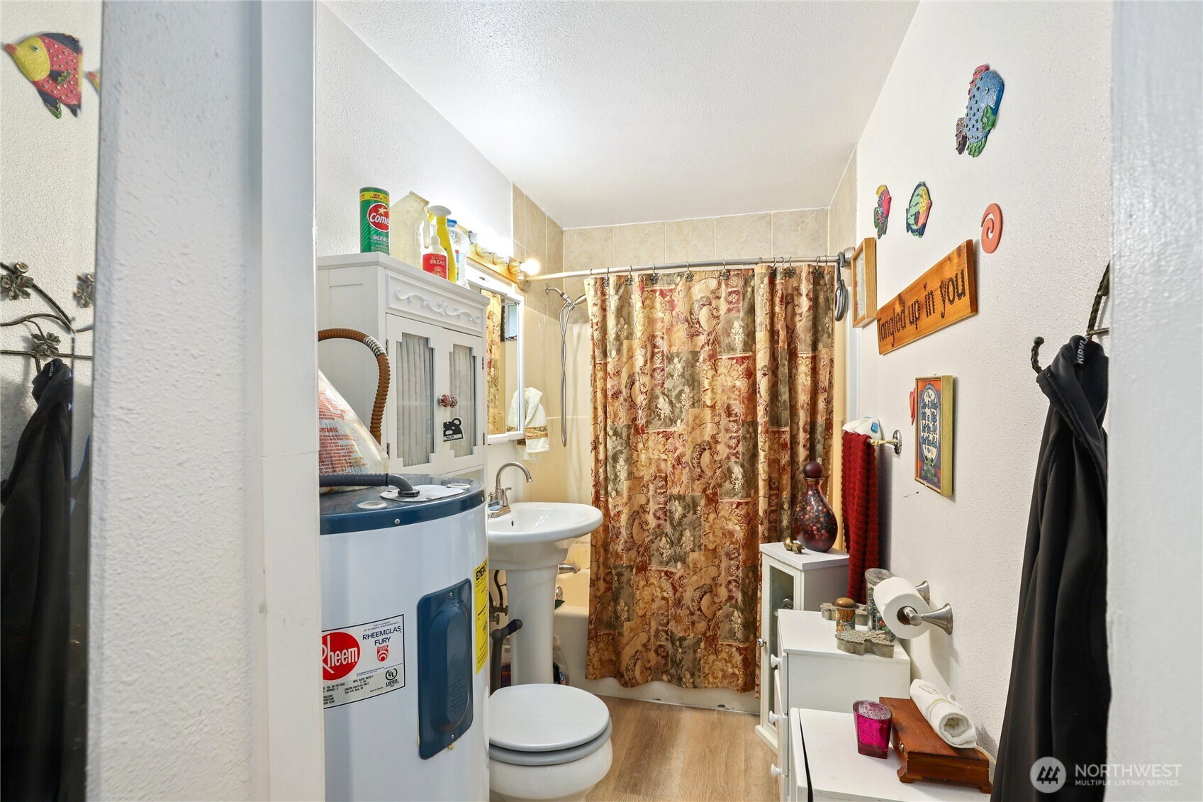 2853 Clare Avenue Bremerton, WA 98310 - Photo 14 of 21 a bathroom with a toilet sink and shower curtain