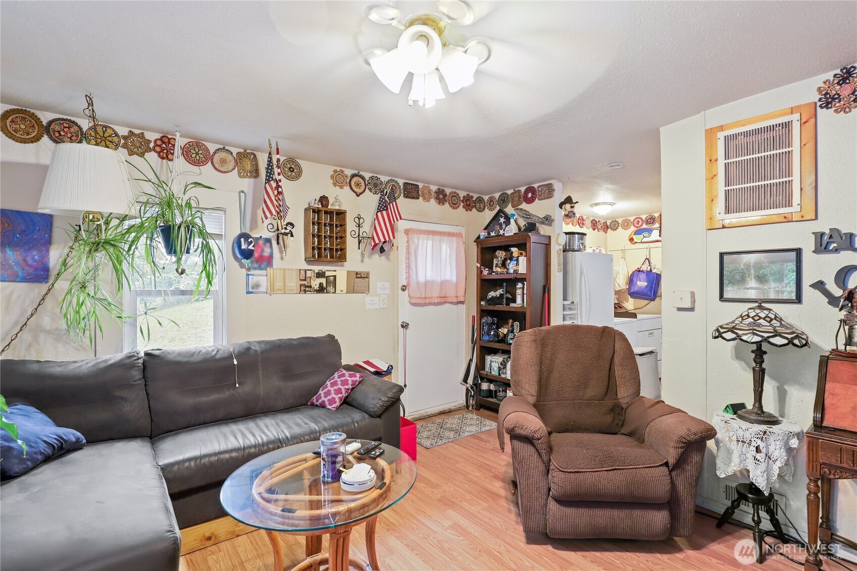 2853 Clare Avenue Bremerton, WA 98310 - Photo 5 of 21 a living room with furniture a chandelier and a window