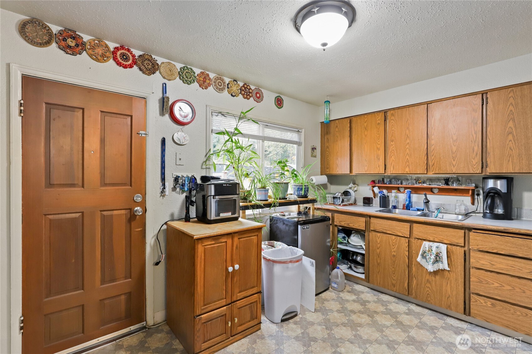 2853 Clare Avenue Bremerton, WA 98310 - Photo 7 of 21 a view of a kitchen with furniture window and stainless steel appliances