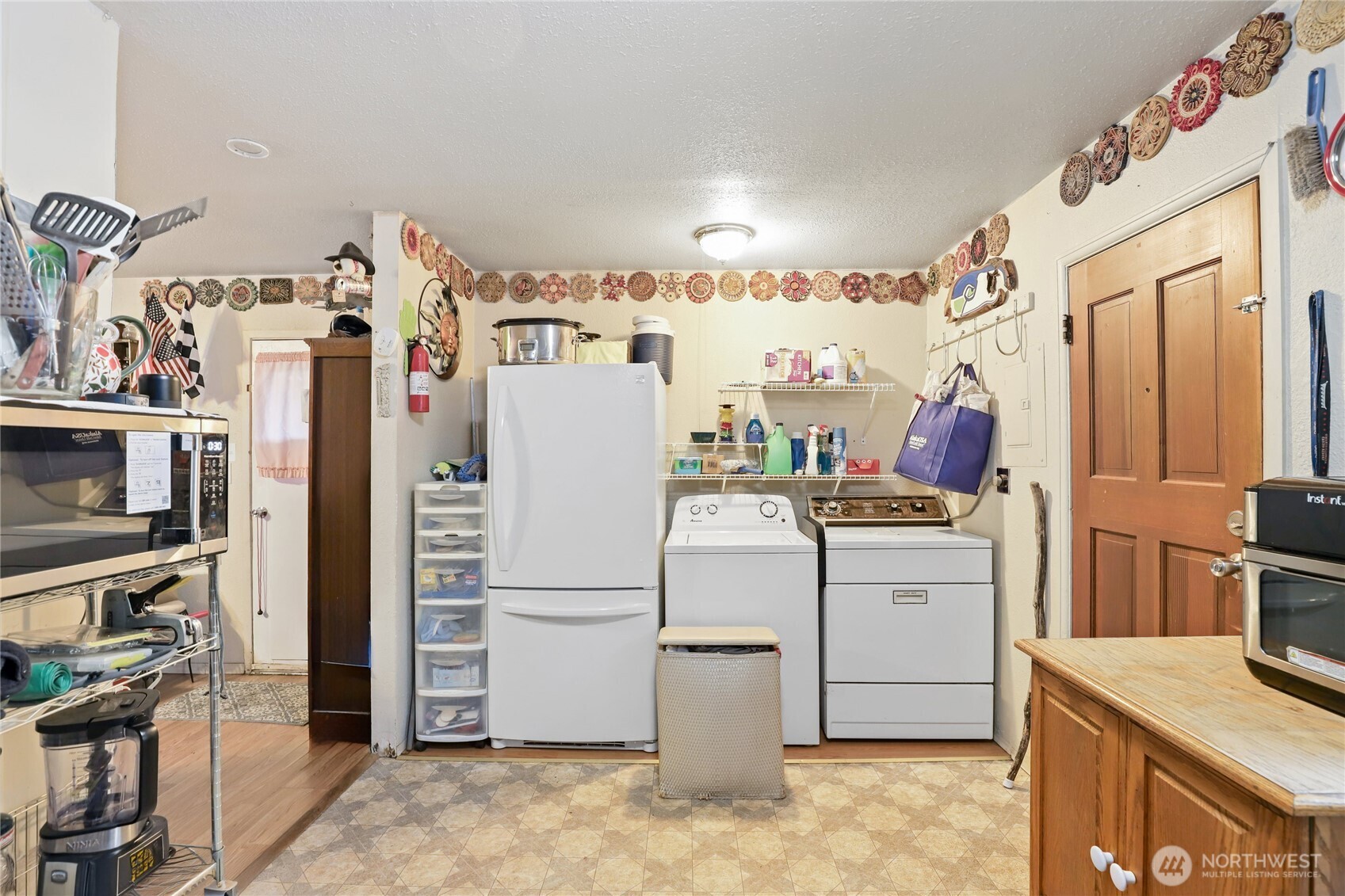 2853 Clare Avenue Bremerton, WA 98310 - Photo 9 of 21 a utility room with cabinets washer and dryer