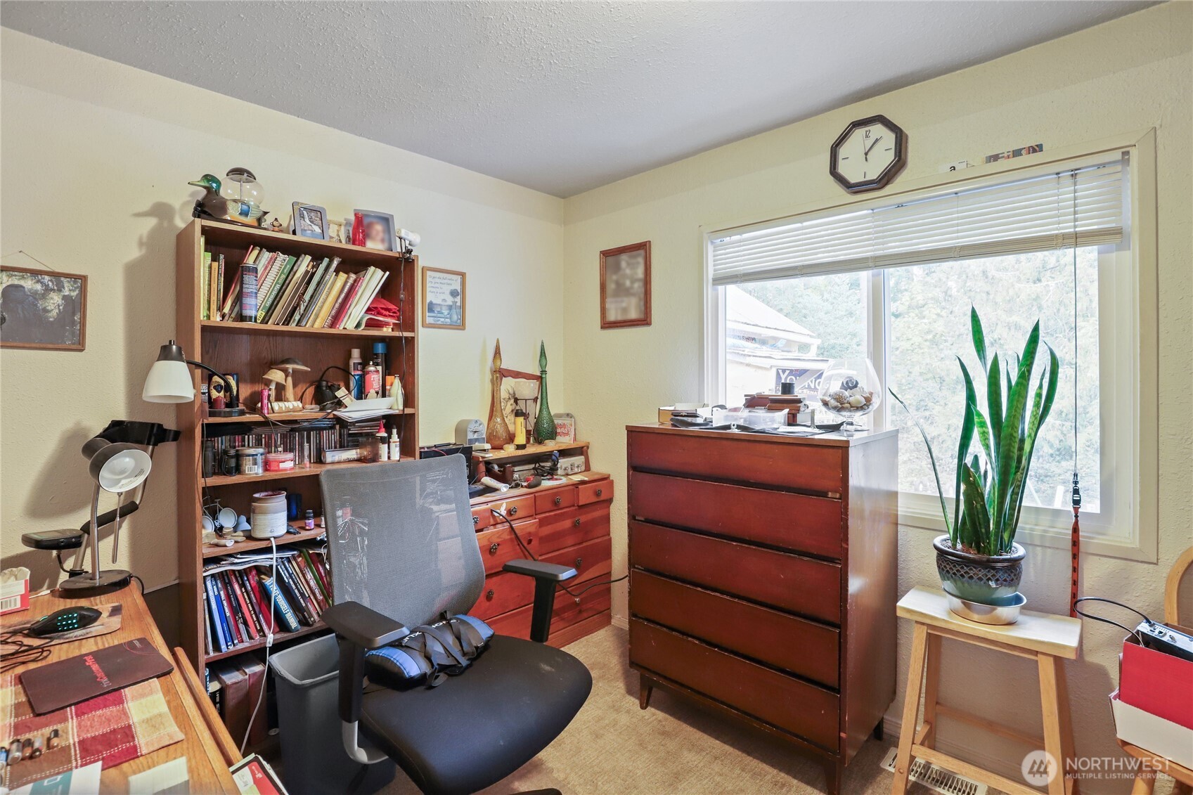 2853 Clare Avenue Bremerton, WA 98310 - Photo 10 of 21 a view of a workspace with furniture and a potted plant