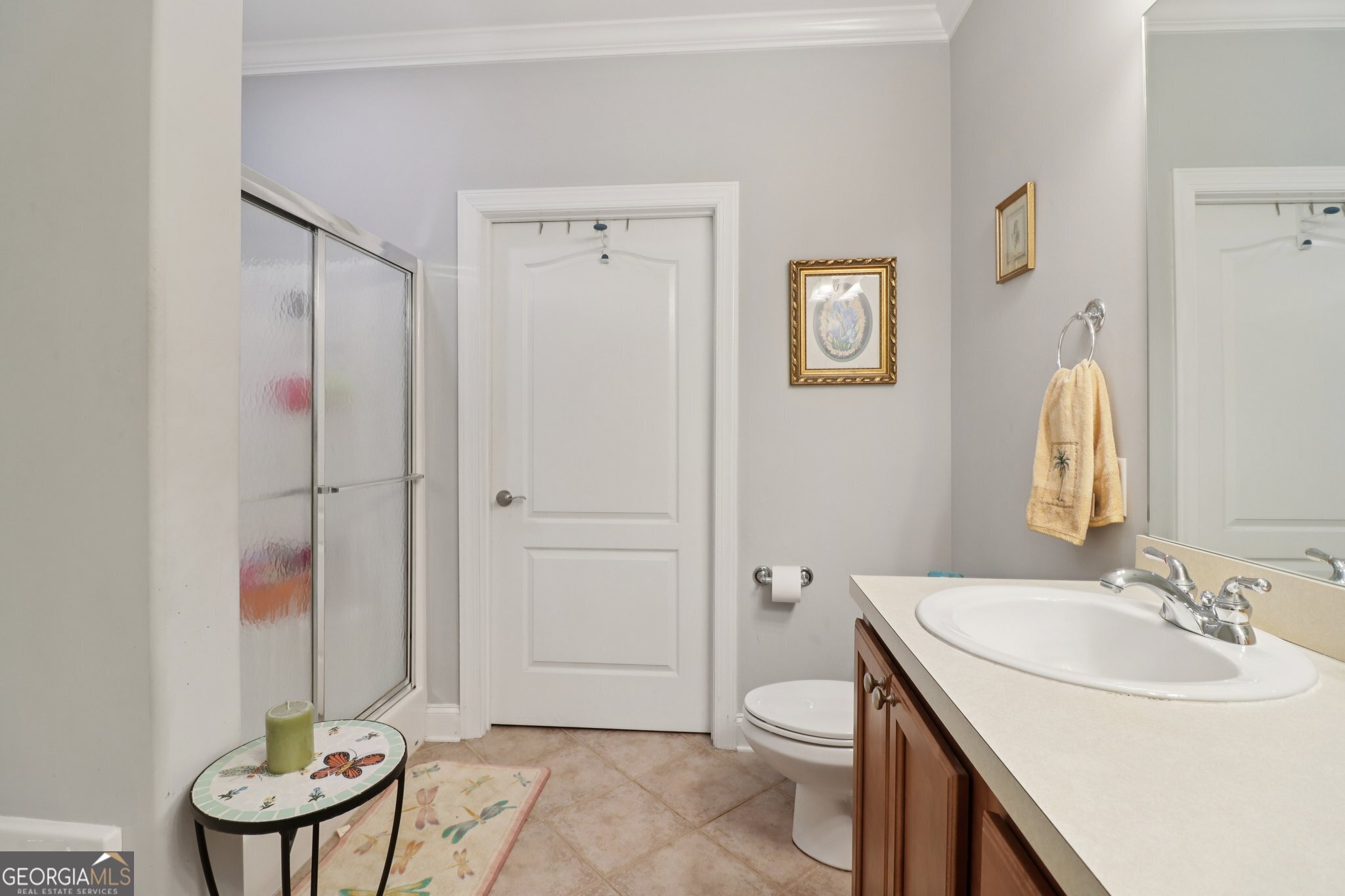 1502 Commonwealth Circle Newnan, GA 30263 - Photo 15 of 30 a bathroom with a sink a toilet and shower curtain