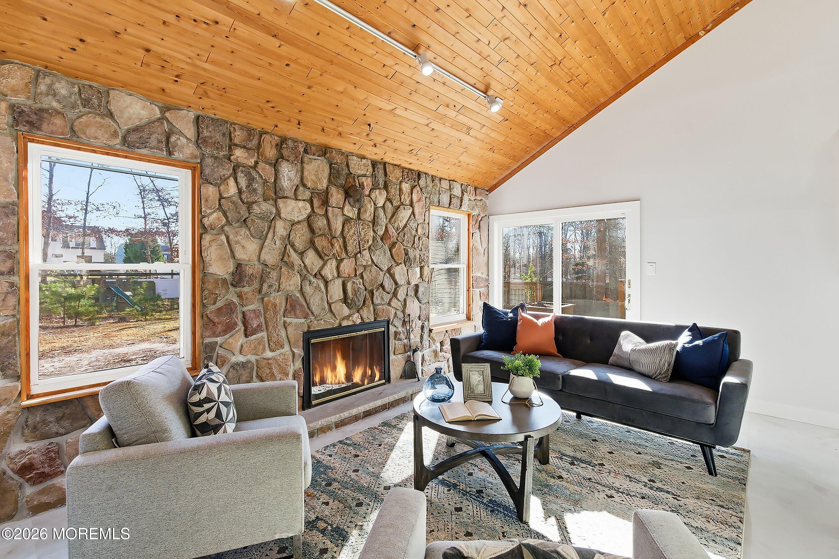 16 6th Street Barnegat, NJ 08005 - Photo 13 of 36 a living room with furniture and a fireplace