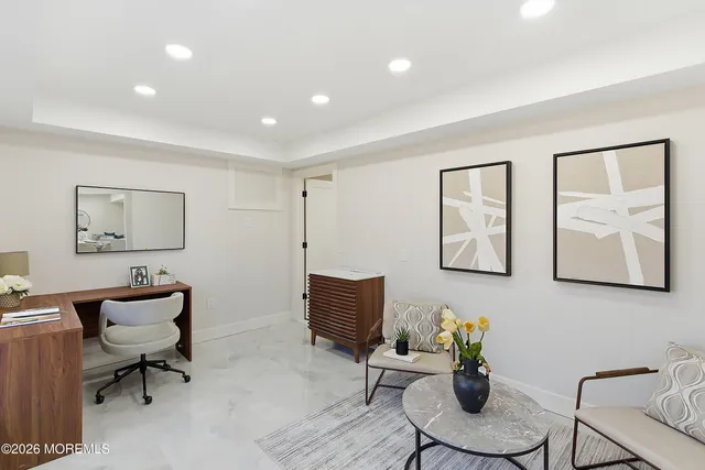 a bedroom with furniture and a window