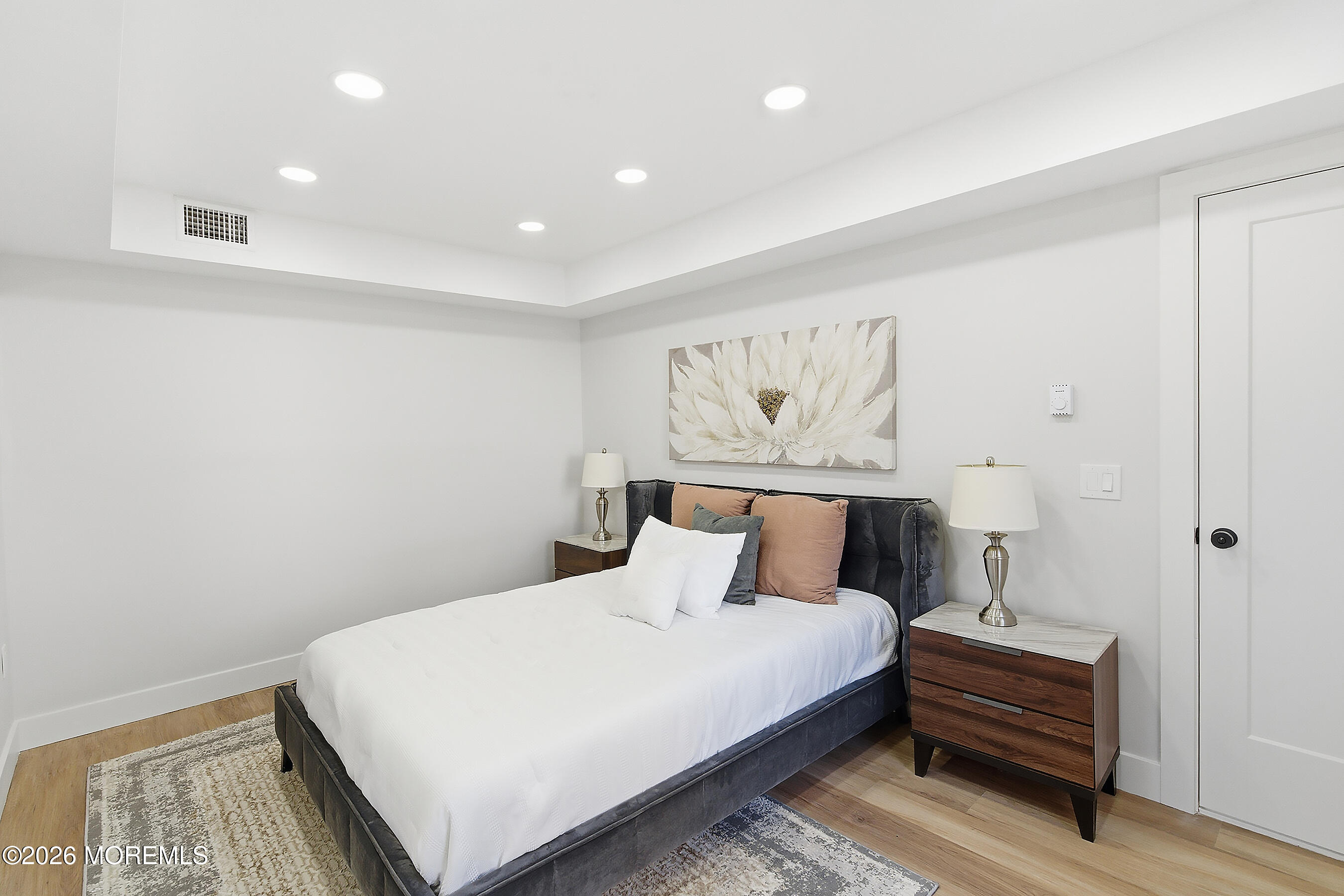 16 6th Street Barnegat, NJ 08005 - Photo 17 of 36 a bedroom with a bed and a painting on the wall