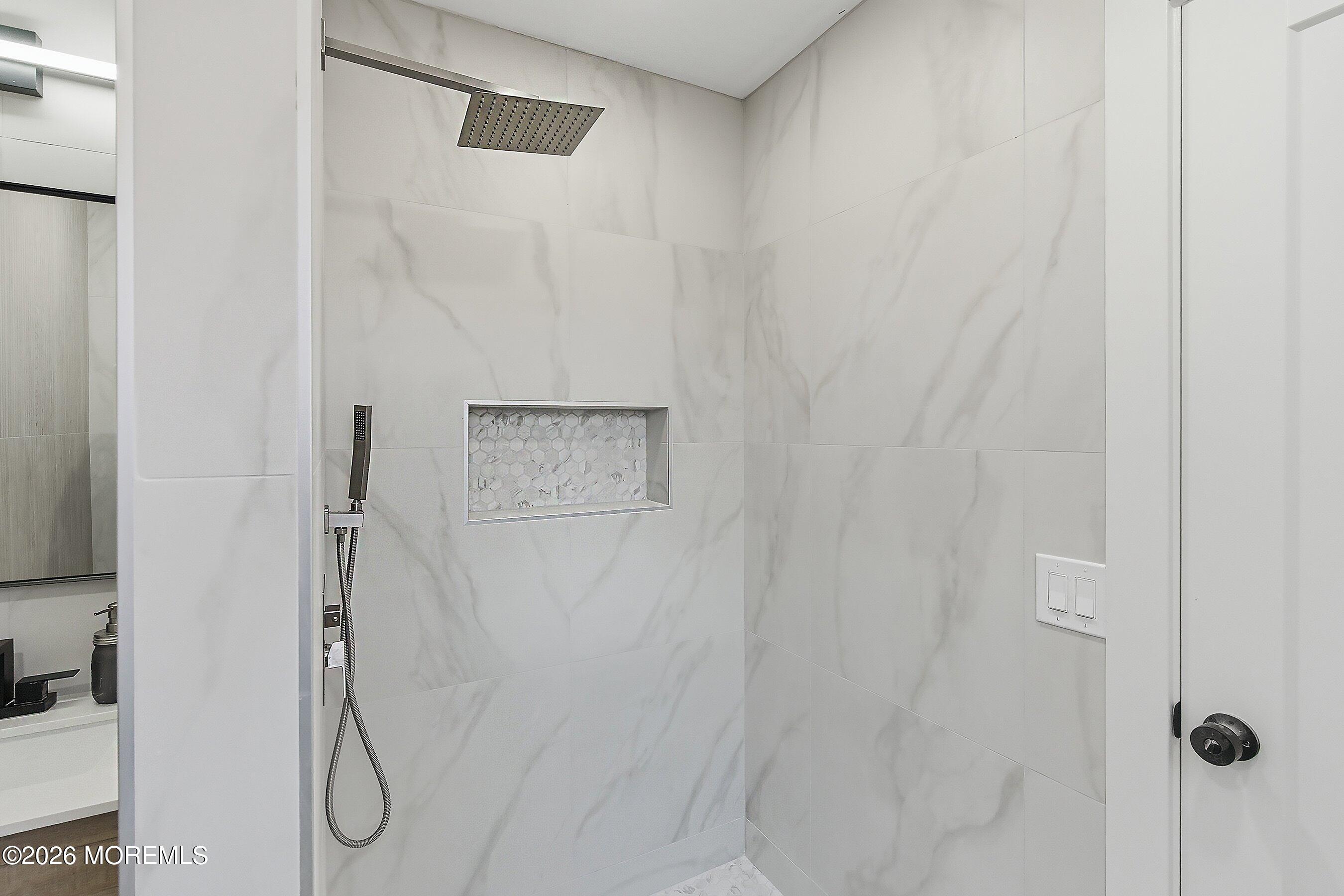 16 6th Street Barnegat, NJ 08005 - Photo 24 of 36 a bathroom with a glass shower door