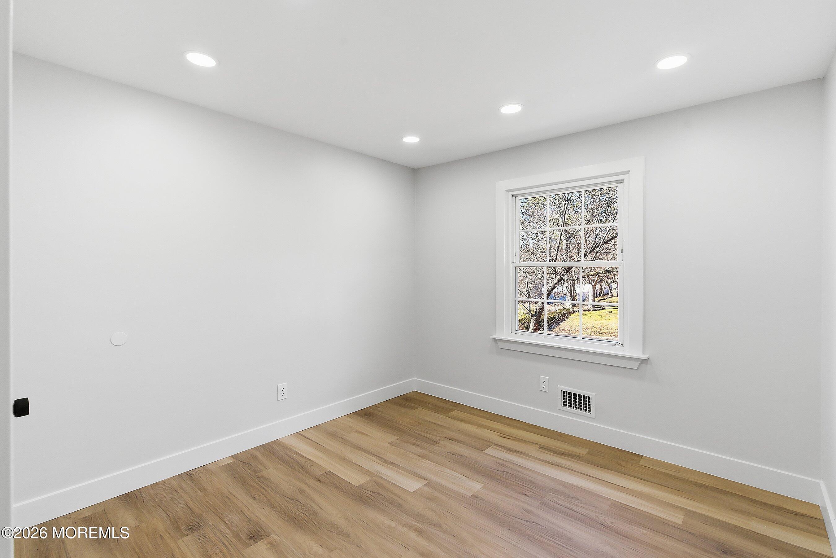 16 6th Street Barnegat, NJ 08005 - Photo 28 of 36 an empty room with windows