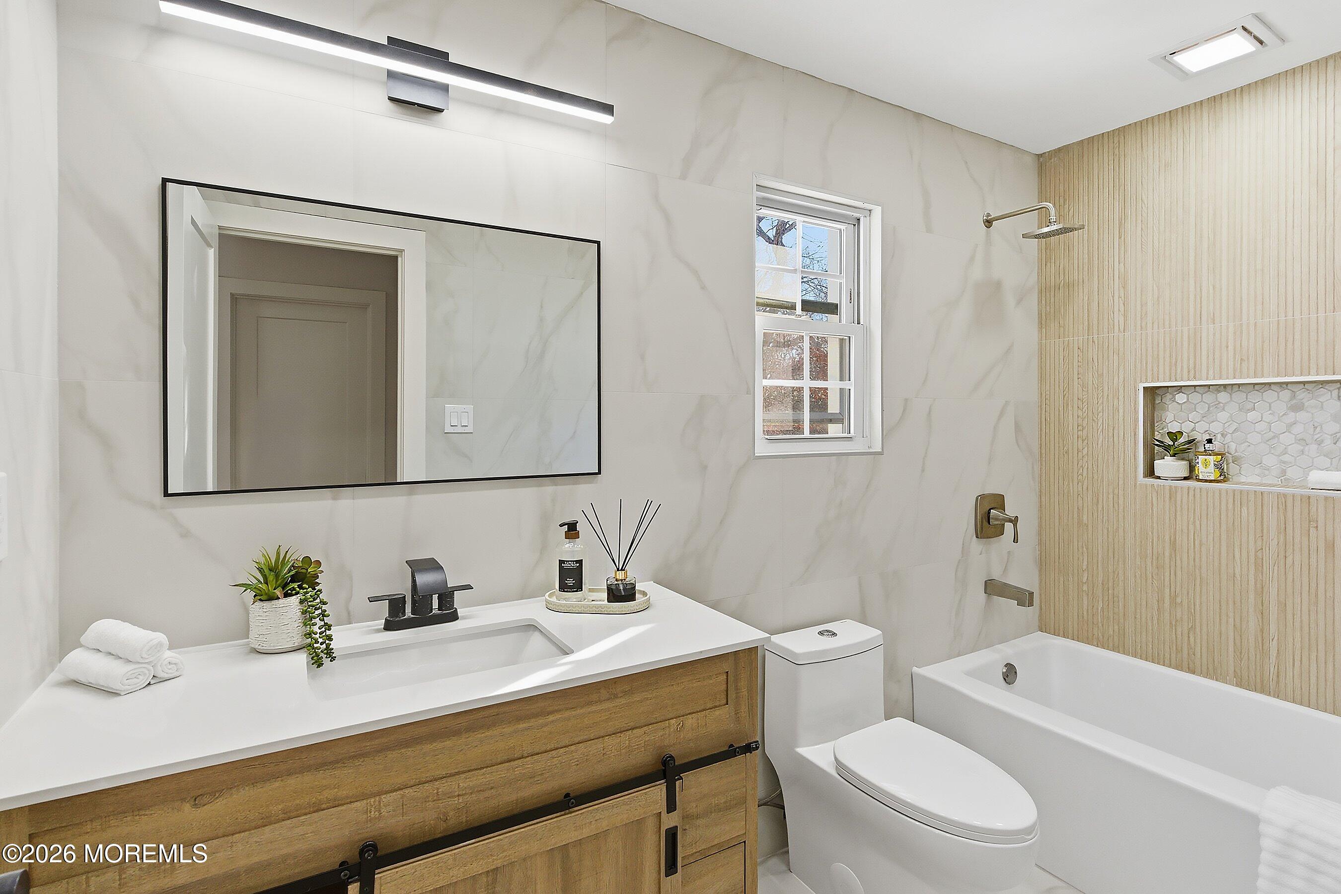 16 6th Street Barnegat, NJ 08005 - Photo 29 of 36 a bathroom with a granite countertop sink mirror vanity and toilet